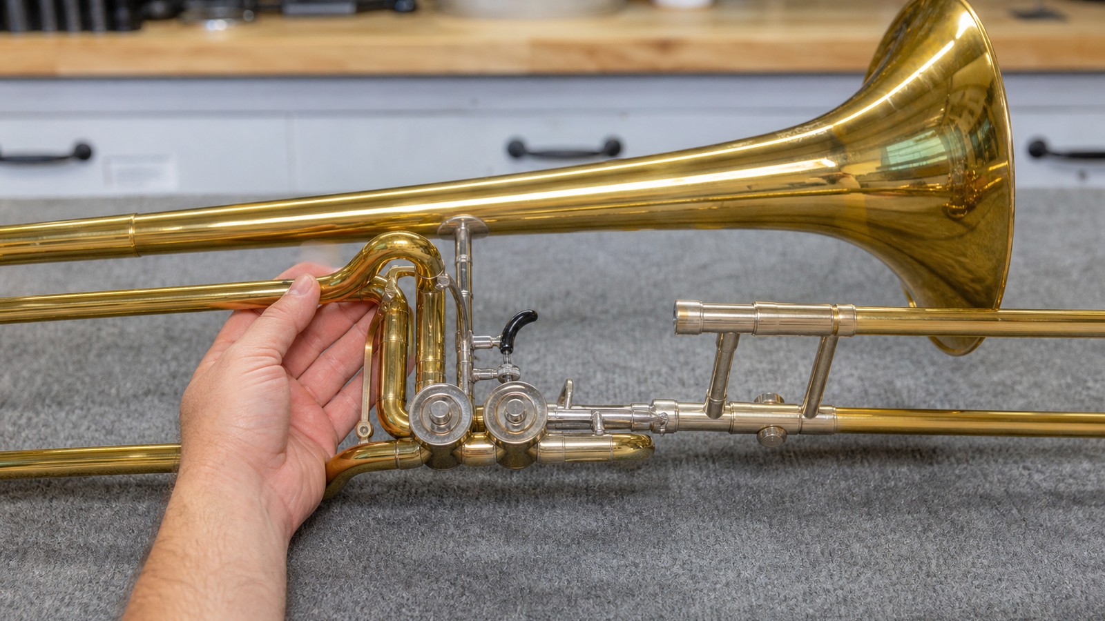 F-attachment trombone valve and tubing on a repair bench